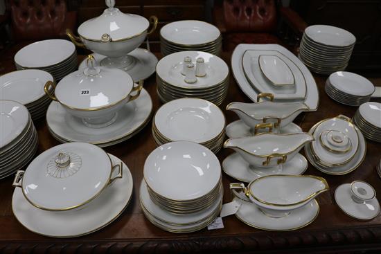 An extensive matched white-glazed and gilt-bordered part dinner service, mainly by Rosenthal